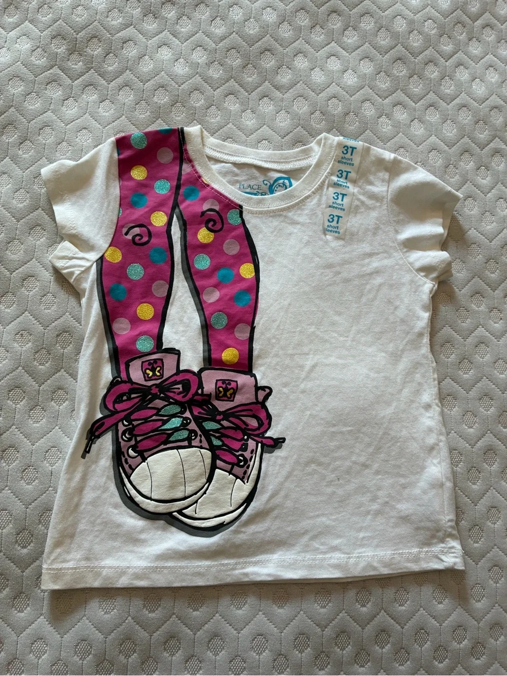 Girl’s White Graphic Tee with Pink Polka-Dot Sneaker Design